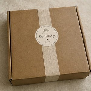 A sealed Kez Artistry box ready to ship
