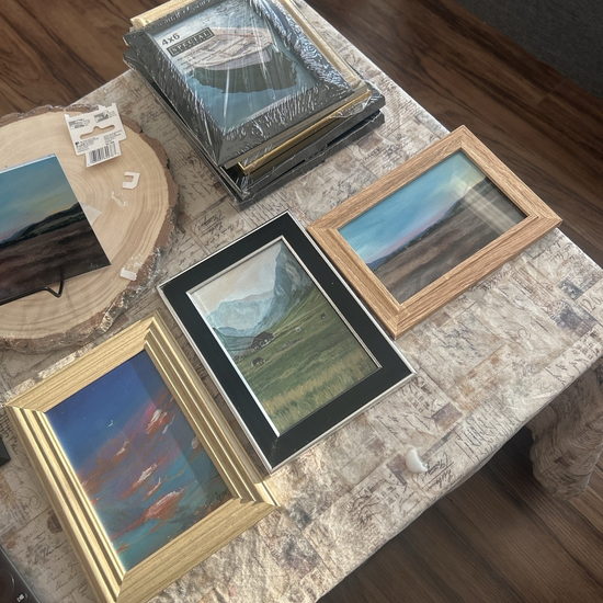 Fine-art prints laid out on the studio table