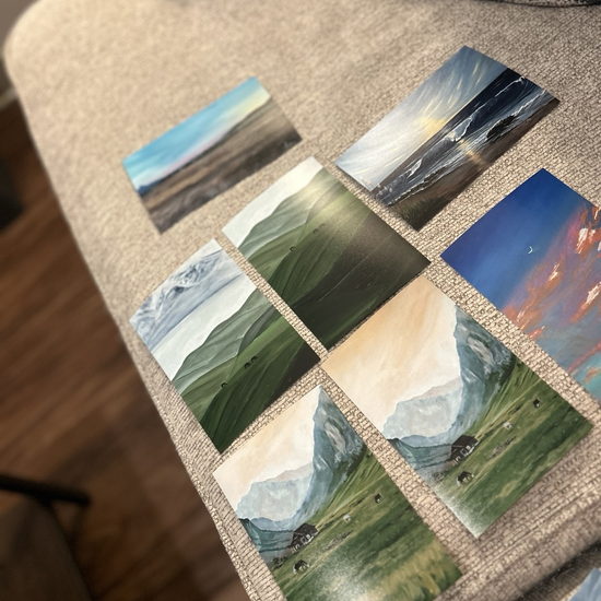 Several finished paintings arranged side by side